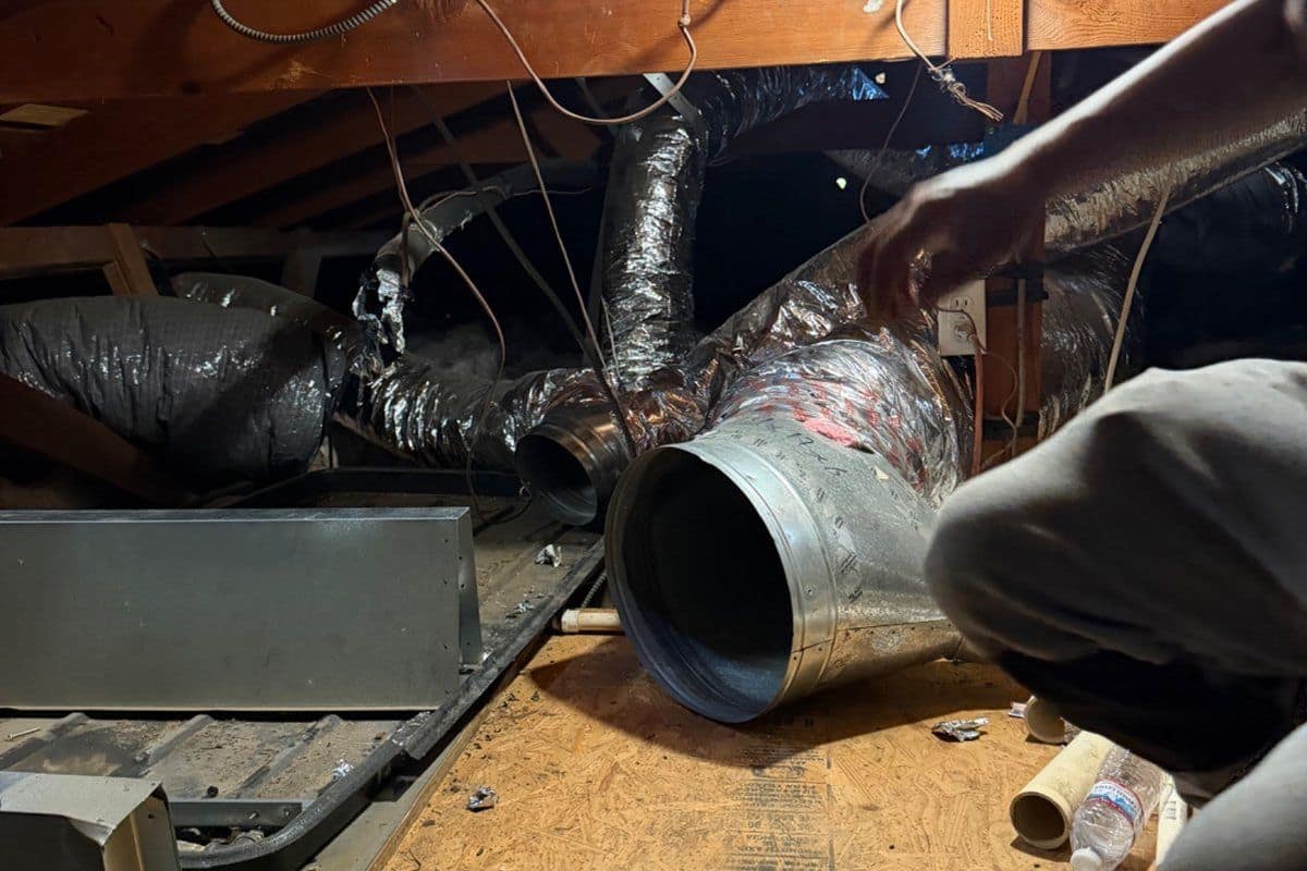 Refrigerant line set and wiring at an outdoor condenser unit showing wear that signals system repair needs